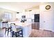 Modern kitchen with white cabinets, stainless steel appliances, and an island at 1011 Overlook Ct, Davenport, FL 33837