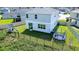 View of backyard with playset, trampoline, and fenced yard at 1011 Overlook Ct, Davenport, FL 33837