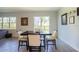 Bright dining area features a table with four chairs and backyard access at 1011 Overlook Ct, Davenport, FL 33837