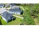 Aerial view of house, backyard with playset and trampoline at 1011 Overlook Ct, Davenport, FL 33837