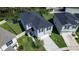 Aerial view of a two-story house with a fenced yard and trampoline at 1011 Overlook Ct, Davenport, FL 33837
