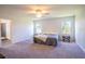 Spacious main bedroom with a king-size bed and en-suite bathroom at 1011 Overlook Ct, Davenport, FL 33837