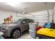 Garage with car, storage, and overhead door opener at 1011 Overlook Ct, Davenport, FL 33837