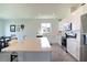 Modern kitchen with white cabinets, stainless steel appliances, and an island at 1011 Overlook Ct, Davenport, FL 33837