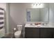 Bathroom with double vanity, shower/tub combo, and toilet at 1011 Overlook Ct, Davenport, FL 33837