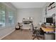 Bright home office features built-in shelving and large window with plantation shutters at 2433 Home Again Rd, Apopka, FL 32712