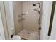 Clean shower with tiled walls and multiple shelves at 1086 Pelham Ct, Winter Haven, FL 33884