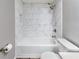 Updated bathroom with marble tile shower and a bathtub at 1086 Pelham Ct, Winter Haven, FL 33884