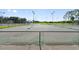 Community tennis courts with chain link fence at 1086 Pelham Ct, Winter Haven, FL 33884