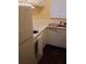 Bright kitchen features white cabinets and appliances at 1700 6Th Nw St # C7, Winter Haven, FL 33881