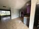 Kitchen with purple cabinets and a view of the living area at 100 Stevenson Rd, Winter Haven, FL 33884