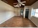 Simple bedroom with wood-look floors and a closet at 100 Stevenson Rd, Winter Haven, FL 33884