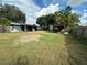 Large backyard with covered patio and shed at 100 Stevenson Rd, Winter Haven, FL 33884