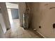 Water heater located in a small utility room at 100 Stevenson Rd, Winter Haven, FL 33884