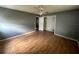 Simple bedroom with wood-look floors and closet at 100 Stevenson Rd, Winter Haven, FL 33884
