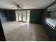 Living room with tile floors and sliding glass doors at 100 Stevenson Rd, Winter Haven, FL 33884