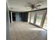 Living room with tile floors and sliding glass doors at 100 Stevenson Rd, Winter Haven, FL 33884