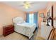 Bedroom with a queen bed, ceiling fan and light walls at 3337 Raleigh Dr, Winter Haven, FL 33884