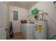 Laundry room with washer, dryer, and shelving at 4234 Cerimen St, Lake Wales, FL 33898