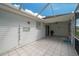 Screened patio with tile floor and ceiling fan at 4234 Cerimen St, Lake Wales, FL 33898