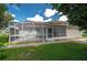 Back exterior view with screened patio at 4234 Cerimen St, Lake Wales, FL 33898