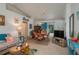 Beach-themed living room featuring a comfy couch and dining area at 4234 Cerimen St, Lake Wales, FL 33898