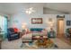Bright living room with comfy seating, coastal decor, and a ceiling fan at 4234 Cerimen St, Lake Wales, FL 33898