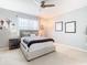 Cozy bedroom with ceiling fan and ample natural light at 278 Alford Dr, Davenport, FL 33896