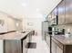 Modern kitchen with stainless steel appliances and dark cabinets at 278 Alford Dr, Davenport, FL 33896