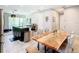 Open concept kitchen and dining area with granite countertops and island at 278 Alford Dr, Davenport, FL 33896