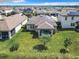 Aerial view showcasing home, solar panels, and neighborhood at 278 Alford Dr, Davenport, FL 33896