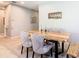 Elegant dining room featuring a live edge wood table and neutral decor at 278 Alford Dr, Davenport, FL 33896