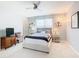 Comfortable bedroom with ceiling fan and TV at 278 Alford Dr, Davenport, FL 33896