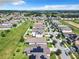Aerial view of a residential neighborhood with houses and solar panels at 278 Alford Dr, Davenport, FL 33896