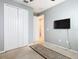 Bedroom with double door closet and wall-mounted TV at 278 Alford Dr, Davenport, FL 33896