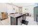 Kitchen island with granite countertop and stainless steel dishwasher at 278 Alford Dr, Davenport, FL 33896