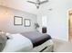 Spacious main bedroom with ceiling fan and ensuite bathroom at 278 Alford Dr, Davenport, FL 33896