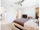 Bright bedroom with ceiling fan and access to bathroom at 278 Alford Dr, Davenport, FL 33896