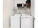 Bright laundry room, featuring washer, dryer, and storage at 278 Alford Dr, Davenport, FL 33896