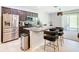 Modern kitchen with stainless steel appliances and granite island at 278 Alford Dr, Davenport, FL 33896