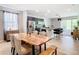 Open concept kitchen and dining area with stainless steel appliances and island at 278 Alford Dr, Davenport, FL 33896