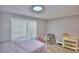 Bright bedroom with double bed, window coverings, and light wood flooring at 4590 San Heath Rd, Bartow, FL 33830