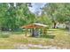 Water well and pump house with wooden cover at 4590 San Heath Rd, Bartow, FL 33830