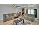 Spacious living room with two sofas, a coffee table, and hardwood floors at 4590 San Heath Rd, Bartow, FL 33830