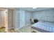 Well-lit bedroom featuring a double bed, built-in desk, and wood-look flooring at 4590 San Heath Rd, Bartow, FL 33830