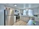 Modern kitchen with stainless steel appliances and light gray cabinets at 4590 San Heath Rd, Bartow, FL 33830