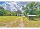 Property overview showing a mobile home, shed and large yard at 4590 San Heath Rd, Bartow, FL 33830