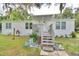 White manufactured home with landscaped yard at 4590 San Heath Rd, Bartow, FL 33830