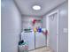 Laundry room with washer, dryer, and storage shelves at 4590 San Heath Rd, Bartow, FL 33830