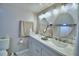 Bathroom with double vanity and round mirrors at 4590 San Heath Rd, Bartow, FL 33830
